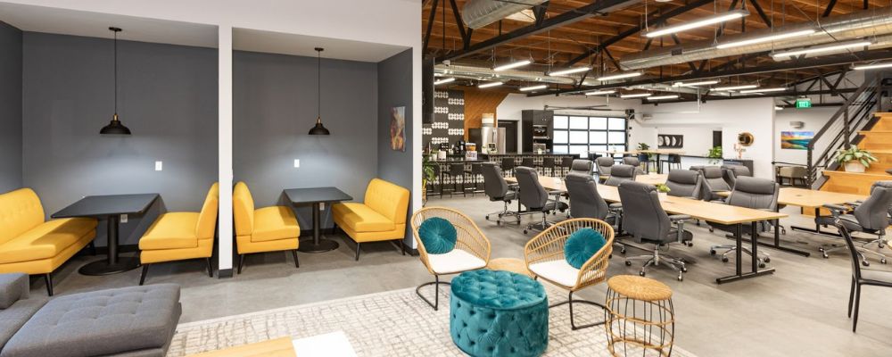 Spacious and open areas to promote interaction and collaboration among members. creative small office interior design